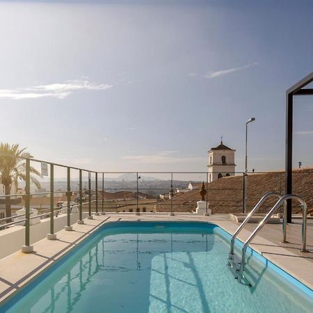 โรงแรมอีลูเนียน เมริดา พาเลซ เมรีดา ภายนอก รูปภาพ Swimming pool at the top of the hotel